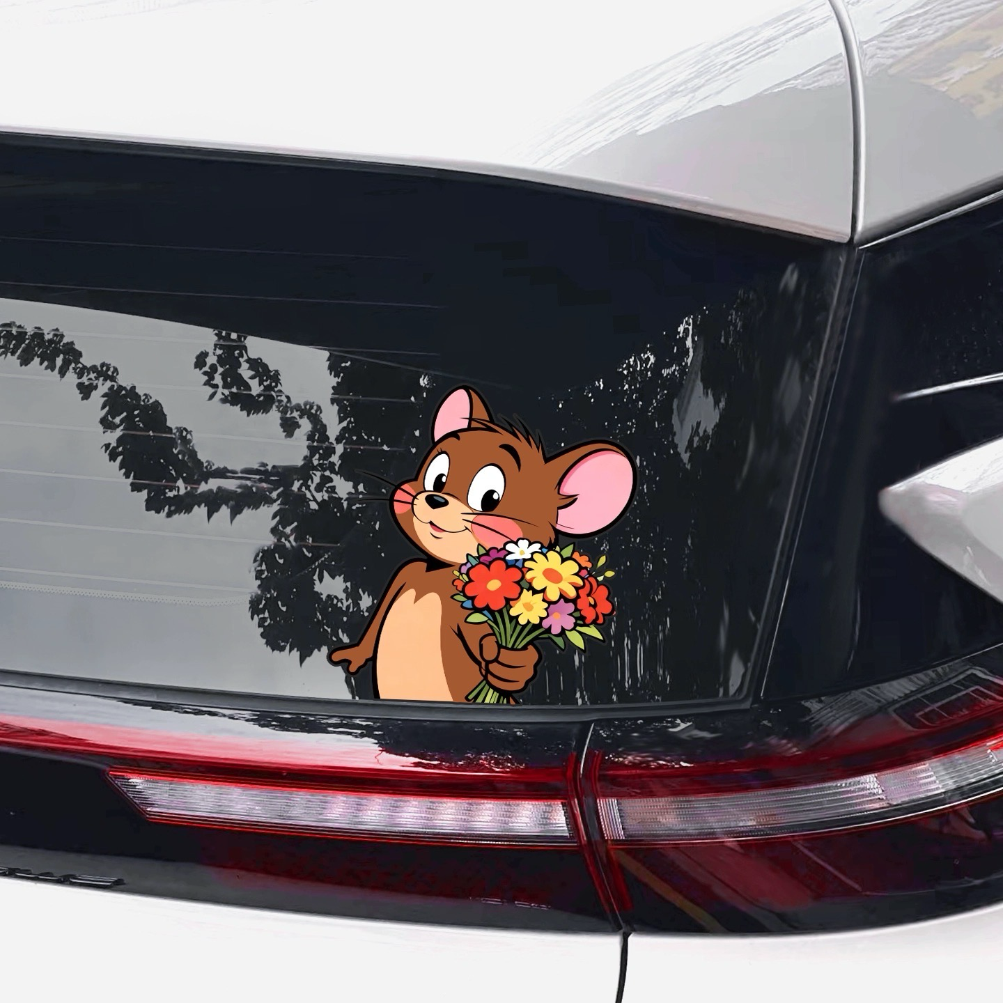 Cute Jerry Mouse car sticker with colorful flowers on the rear window of a modern SUV.
