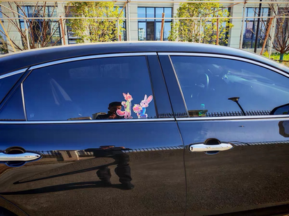 Car window with cartoon character stickers in a residential area