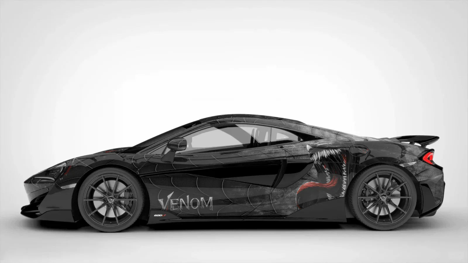 Black sports car with 'Venom' branding on a white background