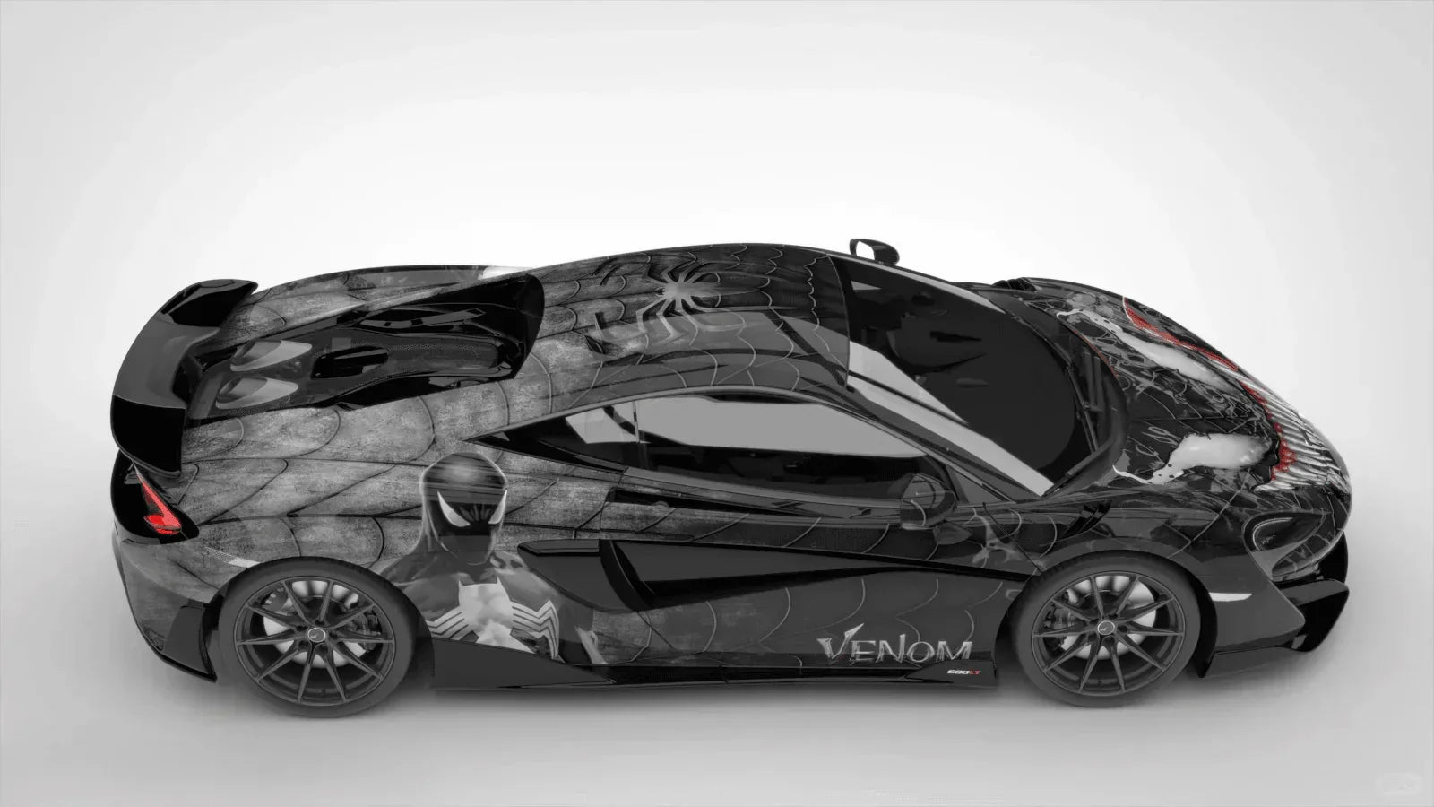 Black and gray sports car with 'Venier' branding on a white background