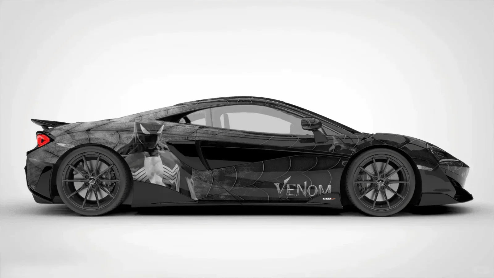 Black sports car with 'Venom' branding on a white background